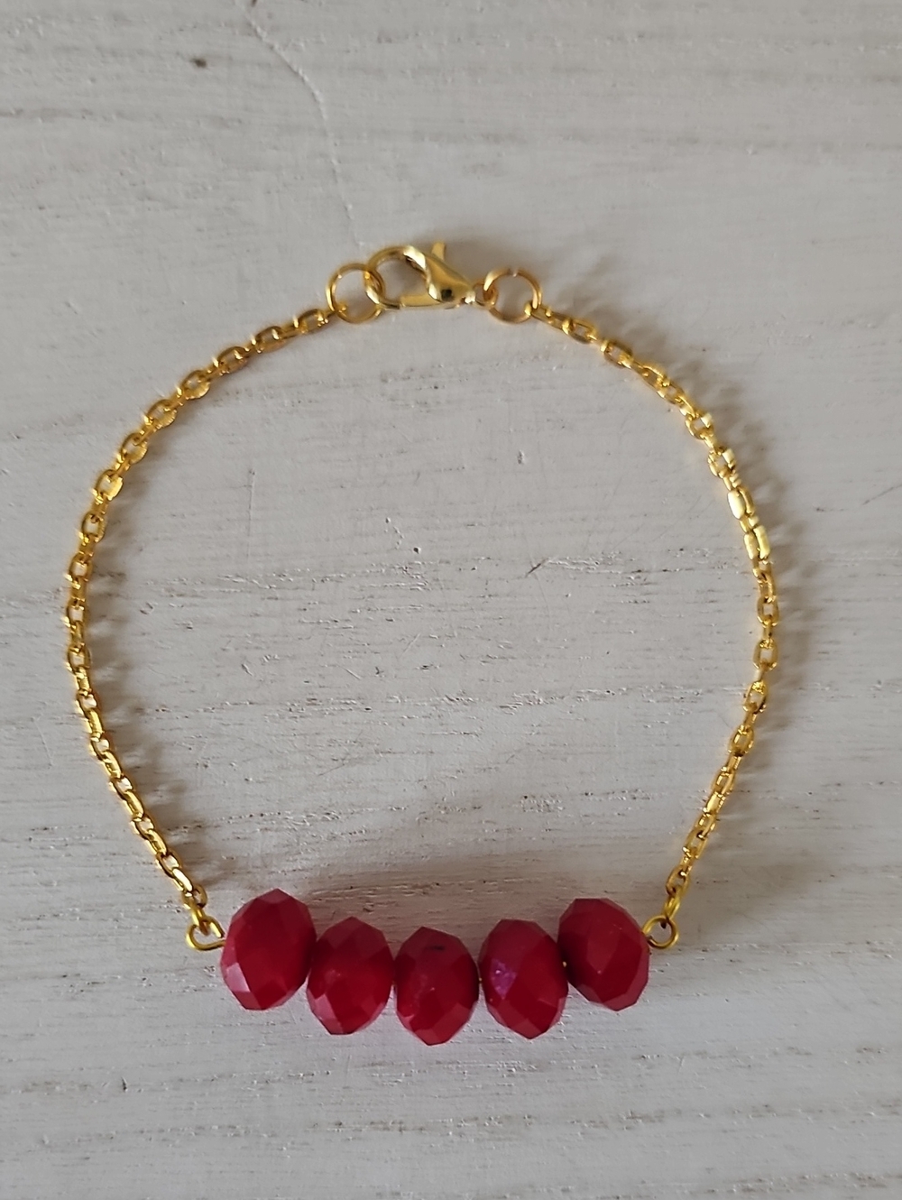 Gold Chain Bracelet with Red Faceted Beads